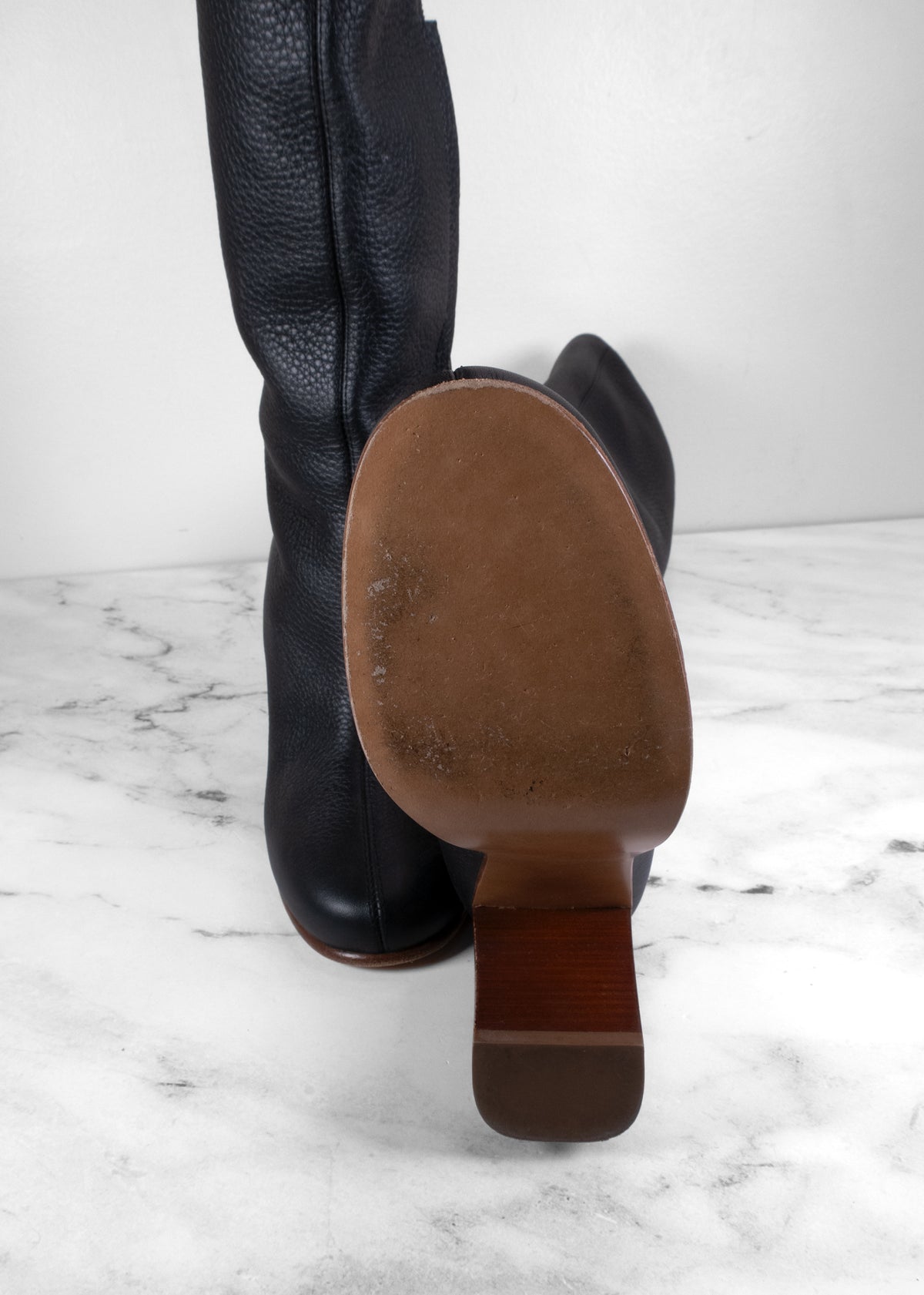 Khaite Black Pebbled Leather Center-Seam Wooden Block Heel Knee-High Boots