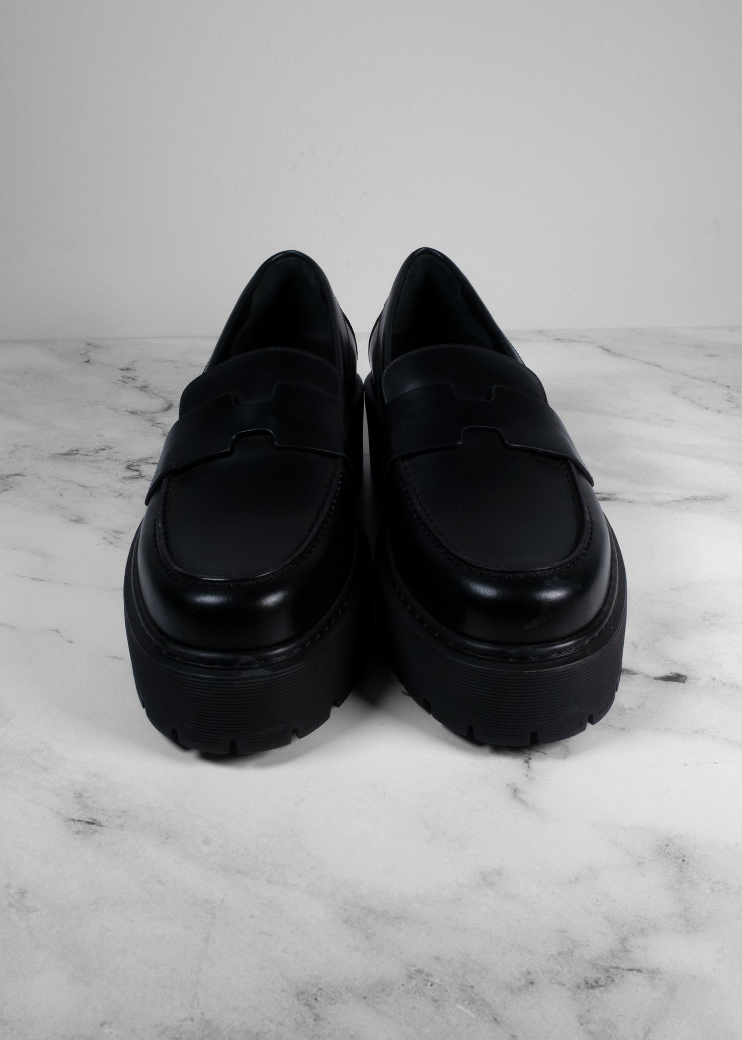 Hermès Black Glazed Leather Hitch Loafers