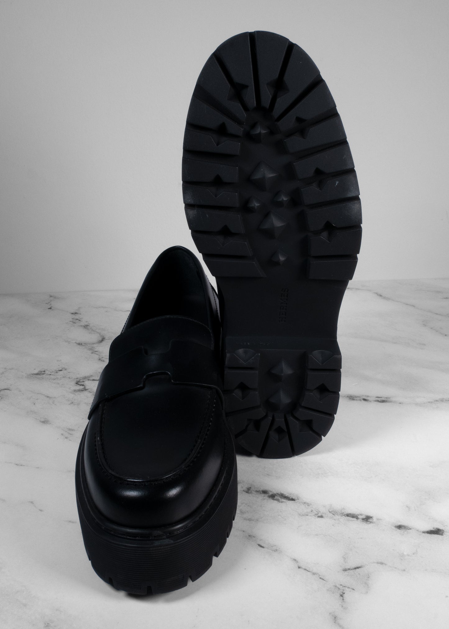 Hermès Black Glazed Leather Hitch Loafers