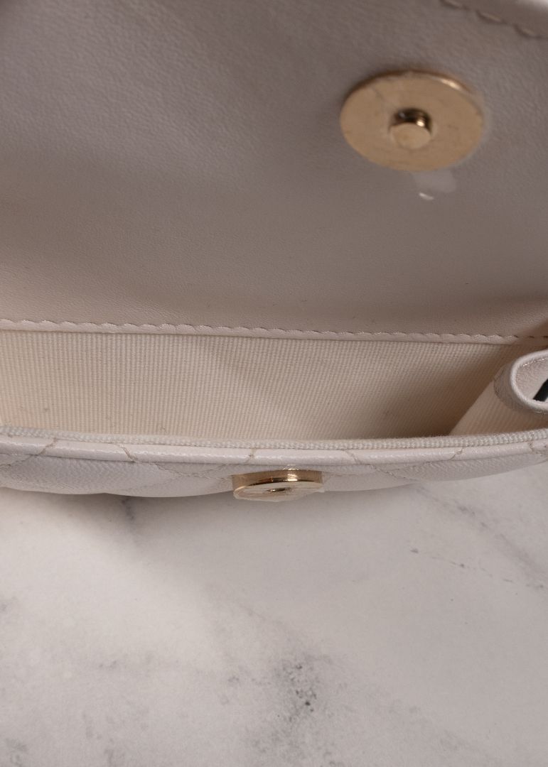 Chanel White Quilted Leather Mini Backpack With Gold Chains And Top Handle