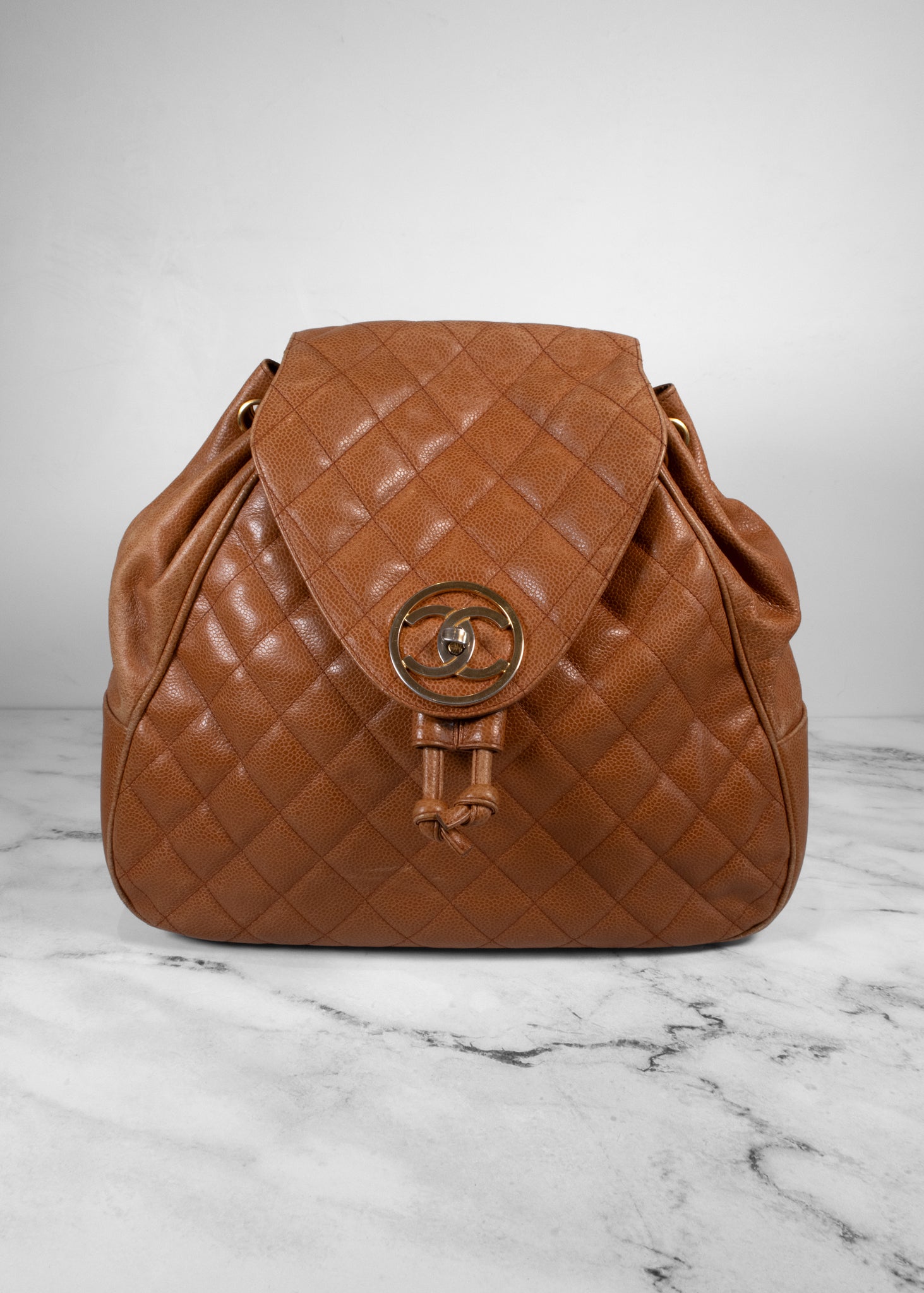 Chanel Vintage Quilted Caviar Leather Circle Turnlock Backpack – Fashion Full Circle