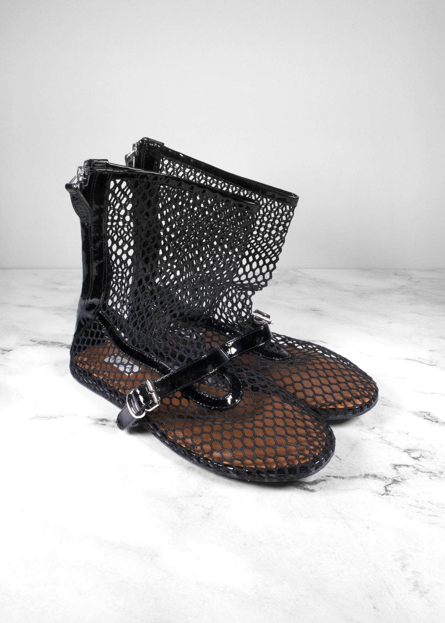 Alaïa Black Fishnet Leather-Trimmed Ankle Boots