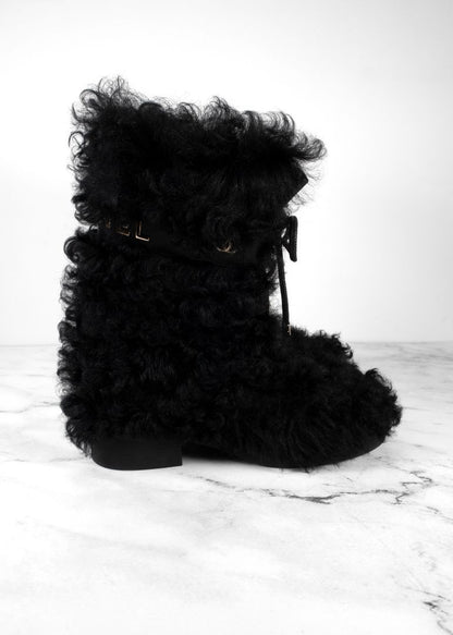 Chanel Black Shearling Boots With Leather Strap And Gold CC Hardware
