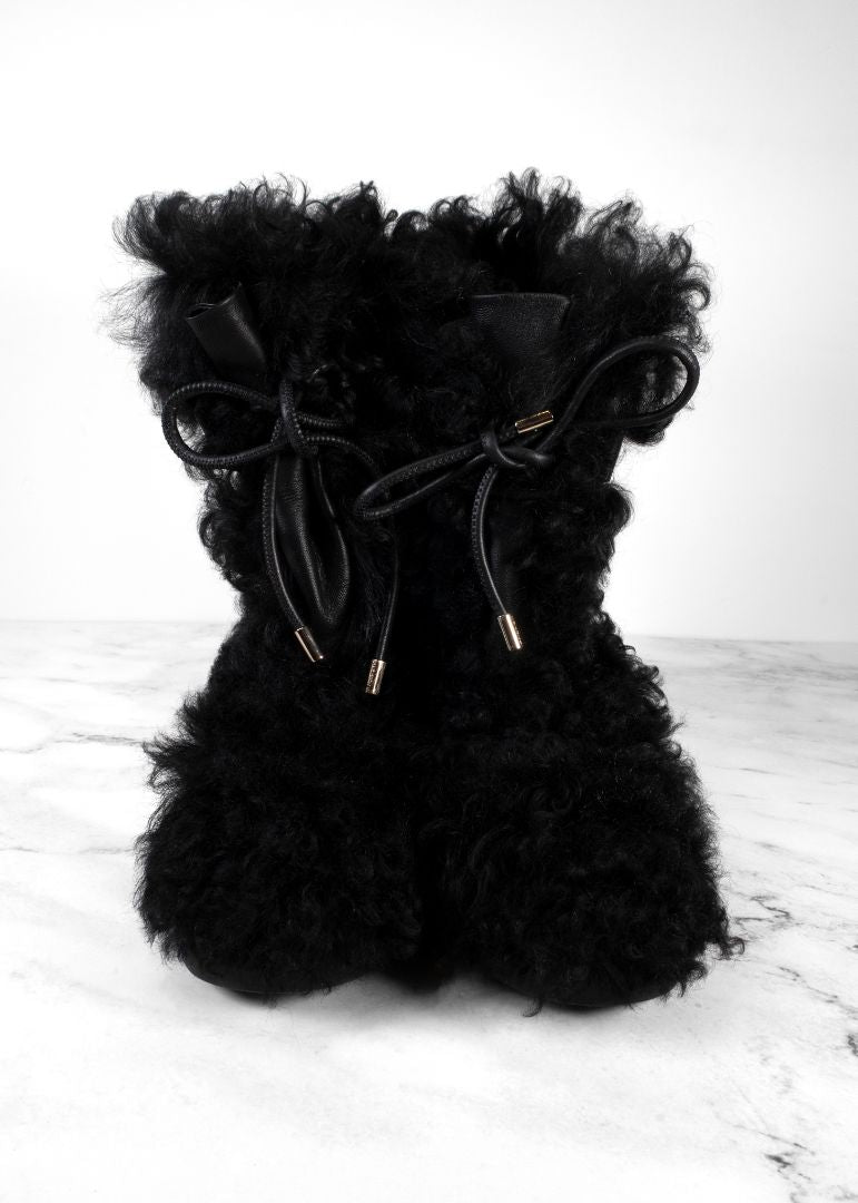 Chanel Black Shearling Boots With Leather Strap And Gold CC Hardware