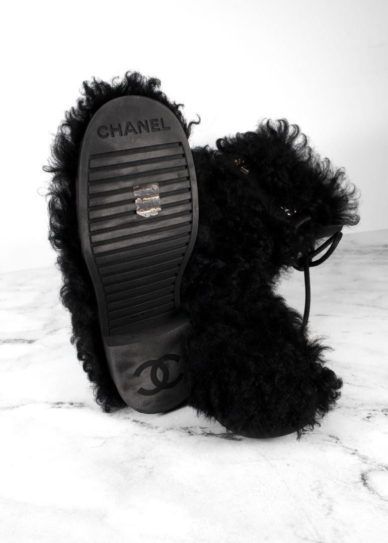 Chanel Black Shearling Boots With Leather Strap And Gold CC Hardware