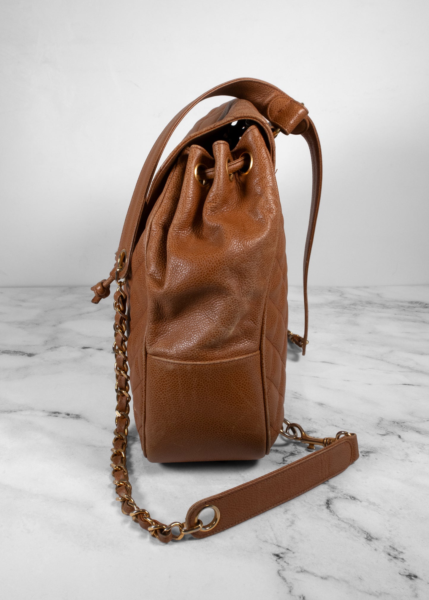 Chanel Vintage Quilted Caviar Leather Circle Turnlock Backpack