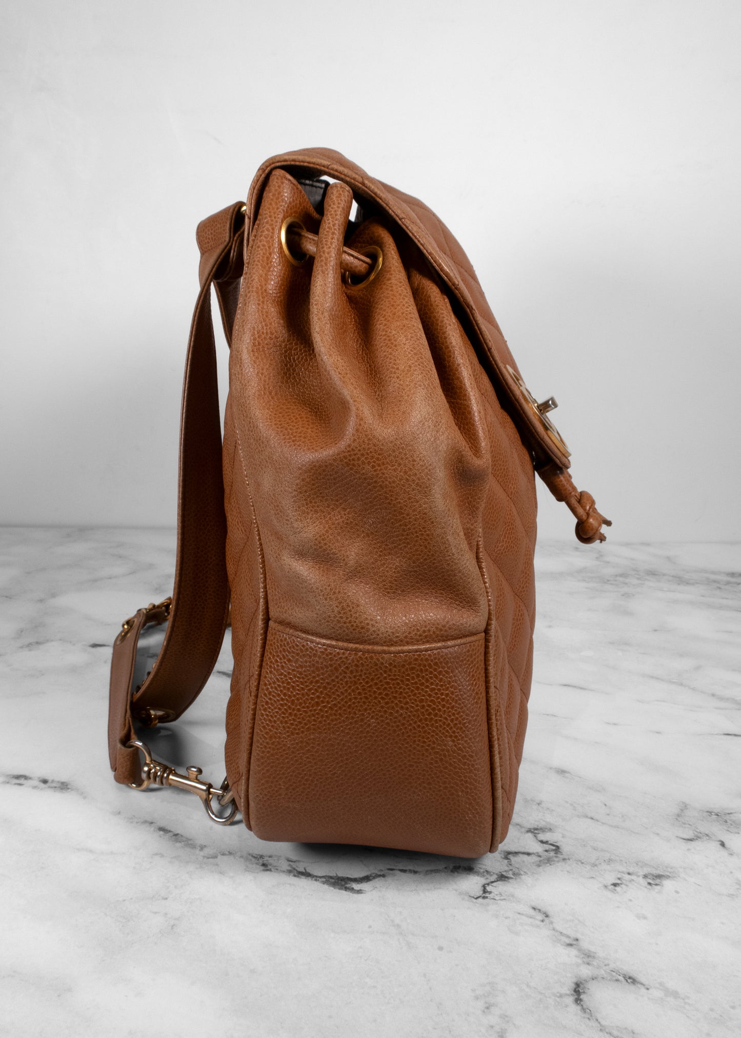 Chanel Vintage Quilted Caviar Leather Circle Turnlock Backpack