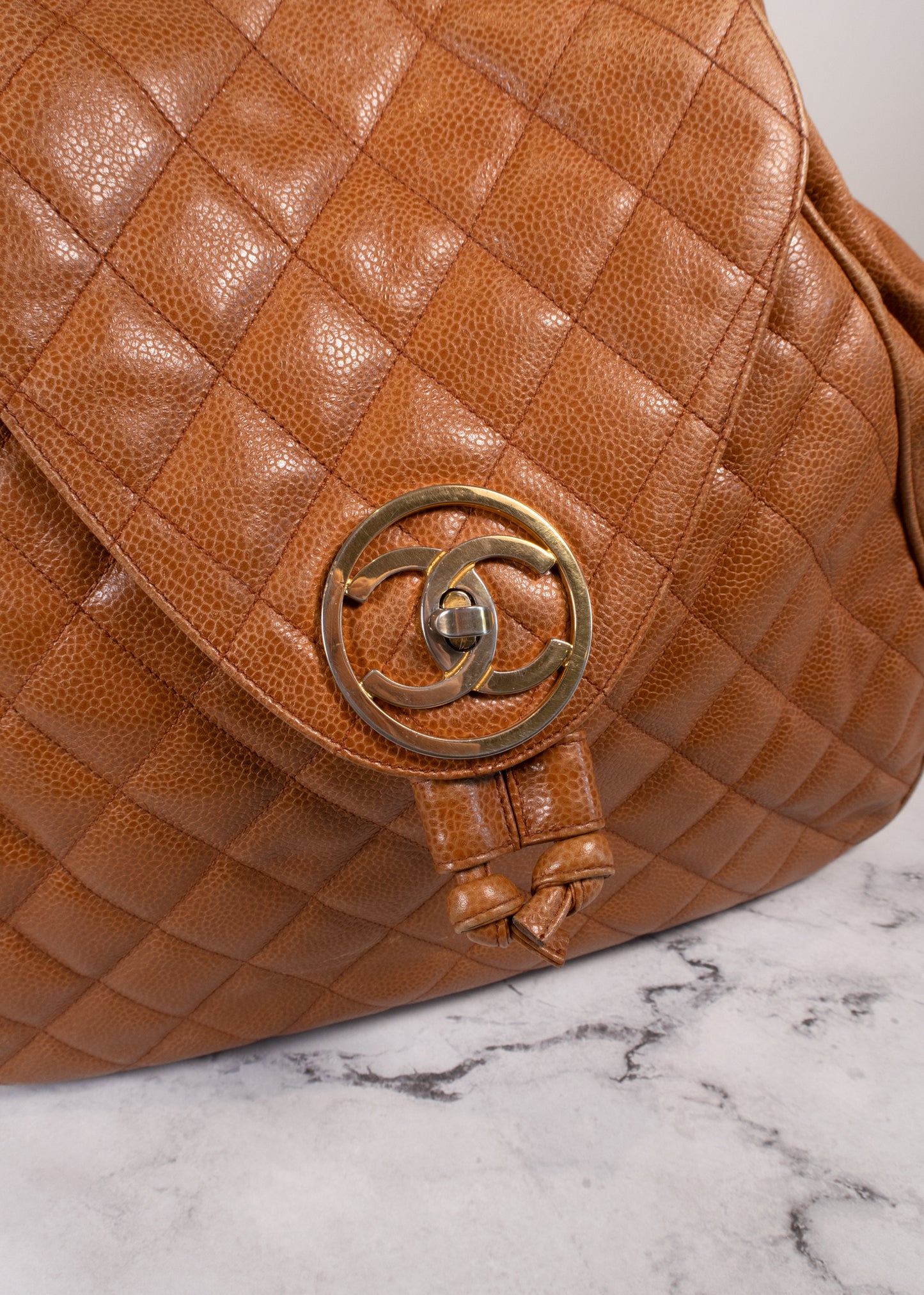 Chanel Vintage Quilted Caviar Leather Circle Turnlock Backpack