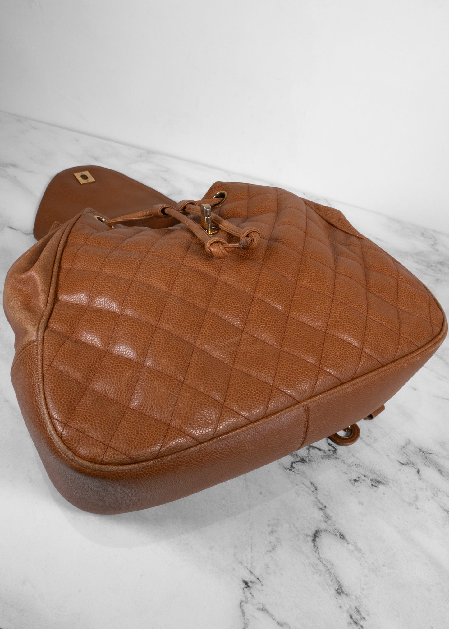 Chanel Vintage Quilted Caviar Leather Circle Turnlock Backpack
